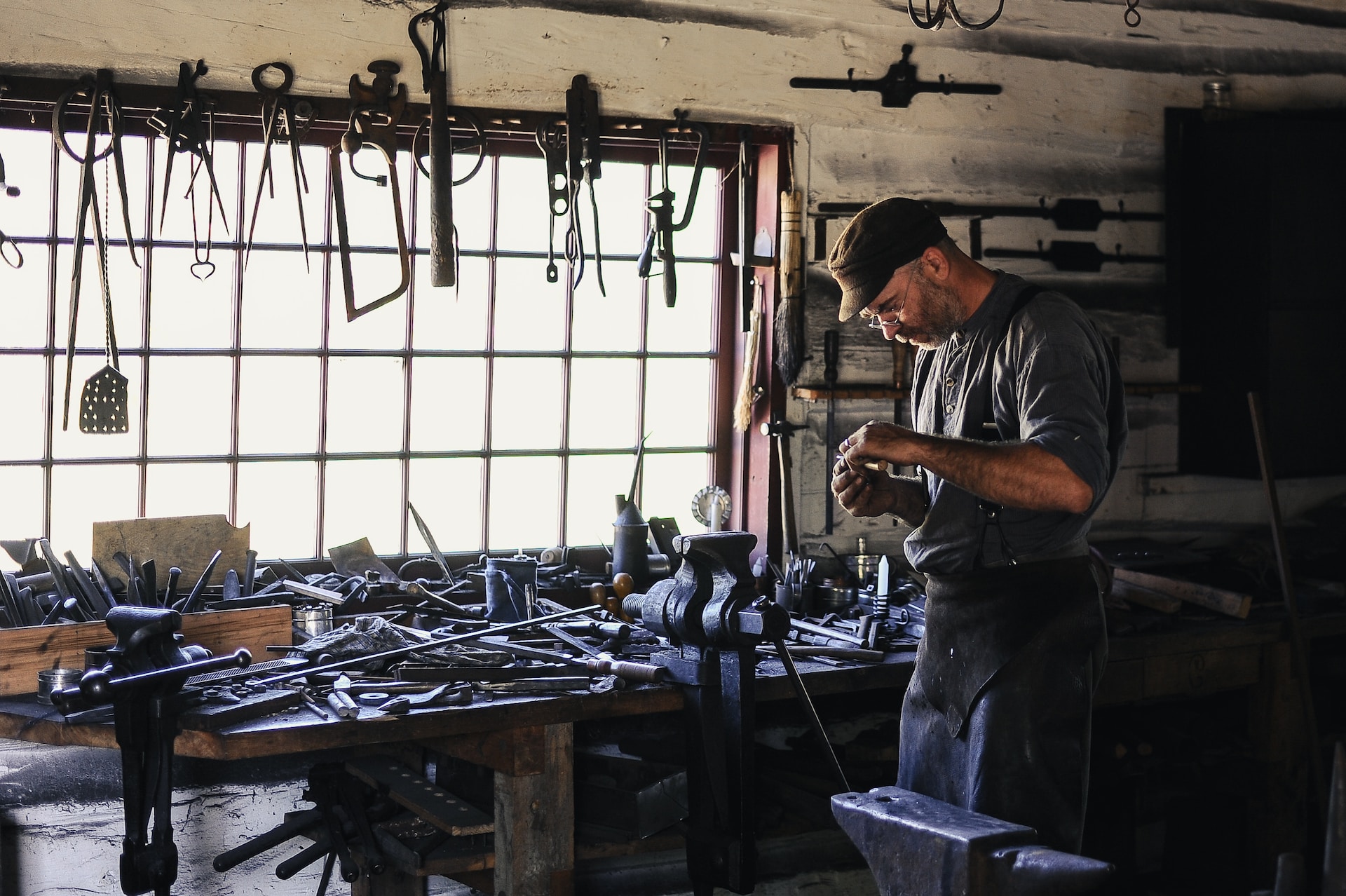 man working inside of a shed