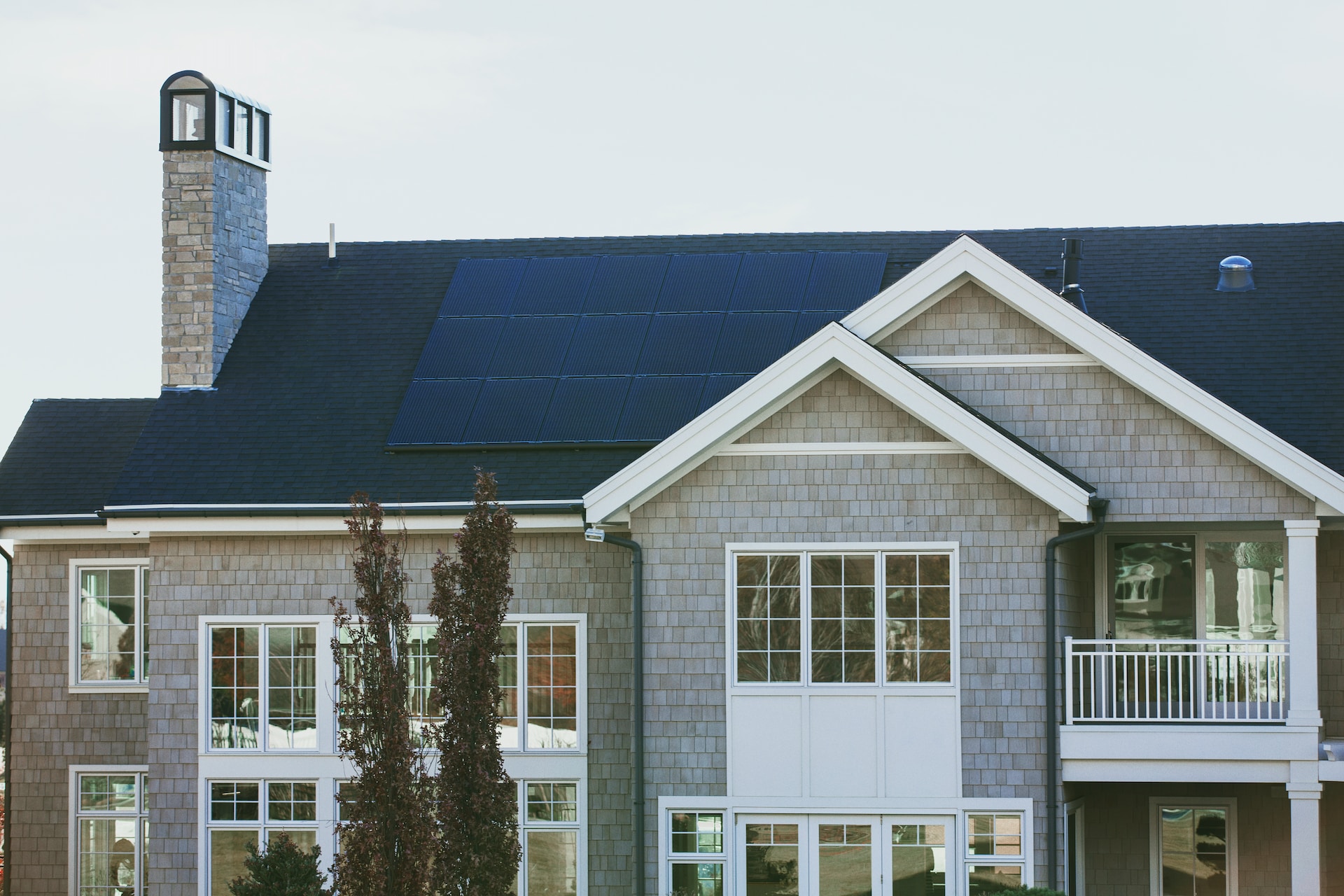 a solar array mounted on a gray house